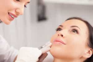 Woman getting BOTOX for an uneven smile cause by Bell's Palsy
